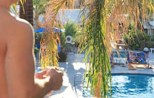 Man Looking Onto Sunbathers at Canyon Club Hotel, Palm Springs
